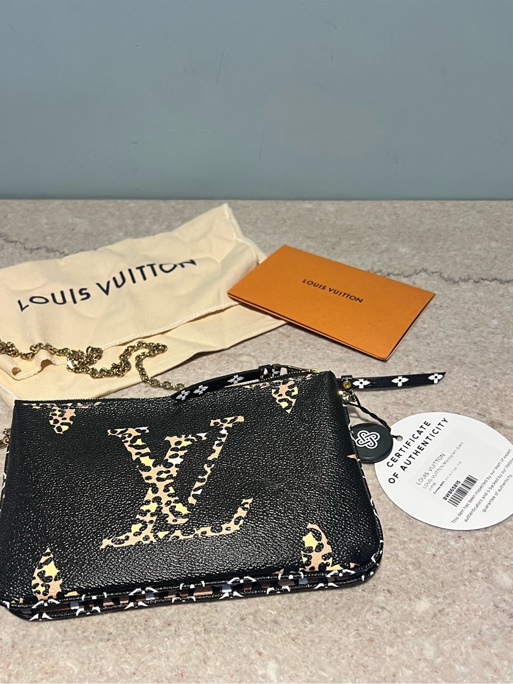 LOUIS VUITTON
Double Zip Jungle Pochette Giant Monogram Leather Crossbody Bag - Picture 4 of 15